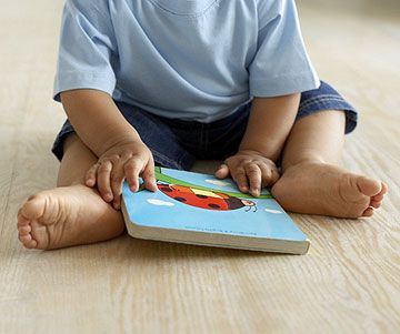 baby holding book